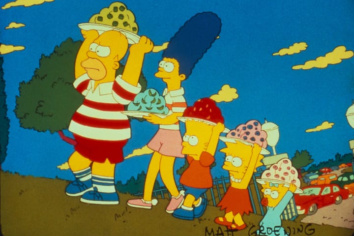When did the The Simpsons debut as a prime-time show?