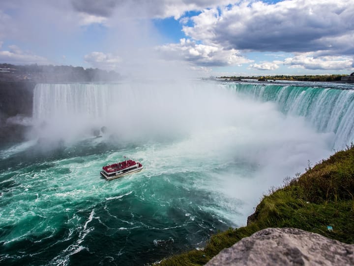 When did the first person successfully go over Niagara Falls in a barrel?